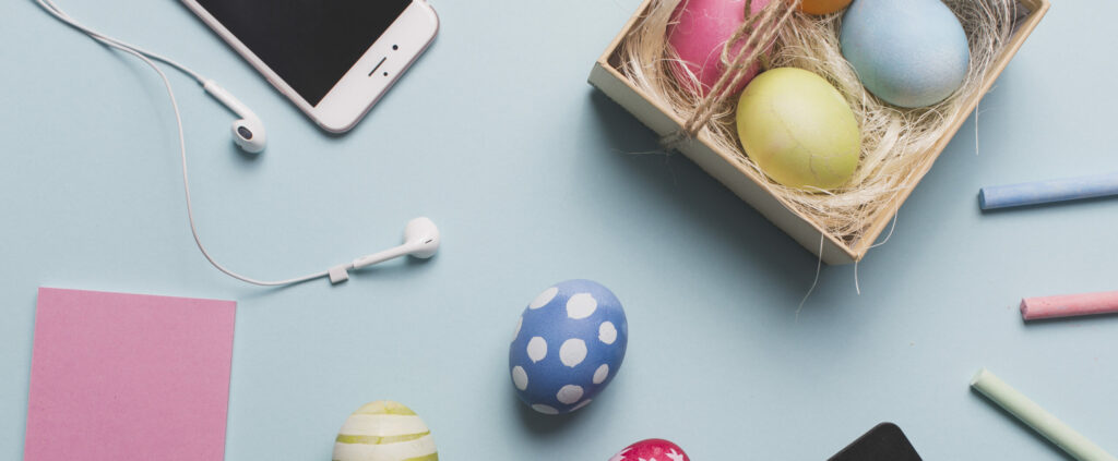 smartphone near colored eggs